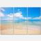 Designart - Large Clouds Over Calm Beach - Seashore Photo Canvas Print